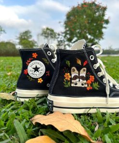 a5 Converse embroidered raccoons are super cute in the middle of a colorful flower garden.