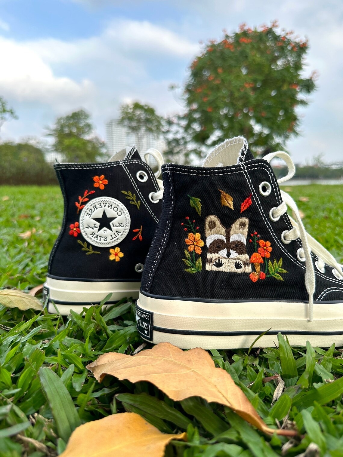 85.1 a5 Converse embroidered raccoons are super cute in the middle of a colorful flower garden.