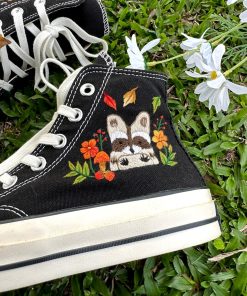 a3 Converse embroidered raccoons are super cute in the middle of a colorful flower garden.