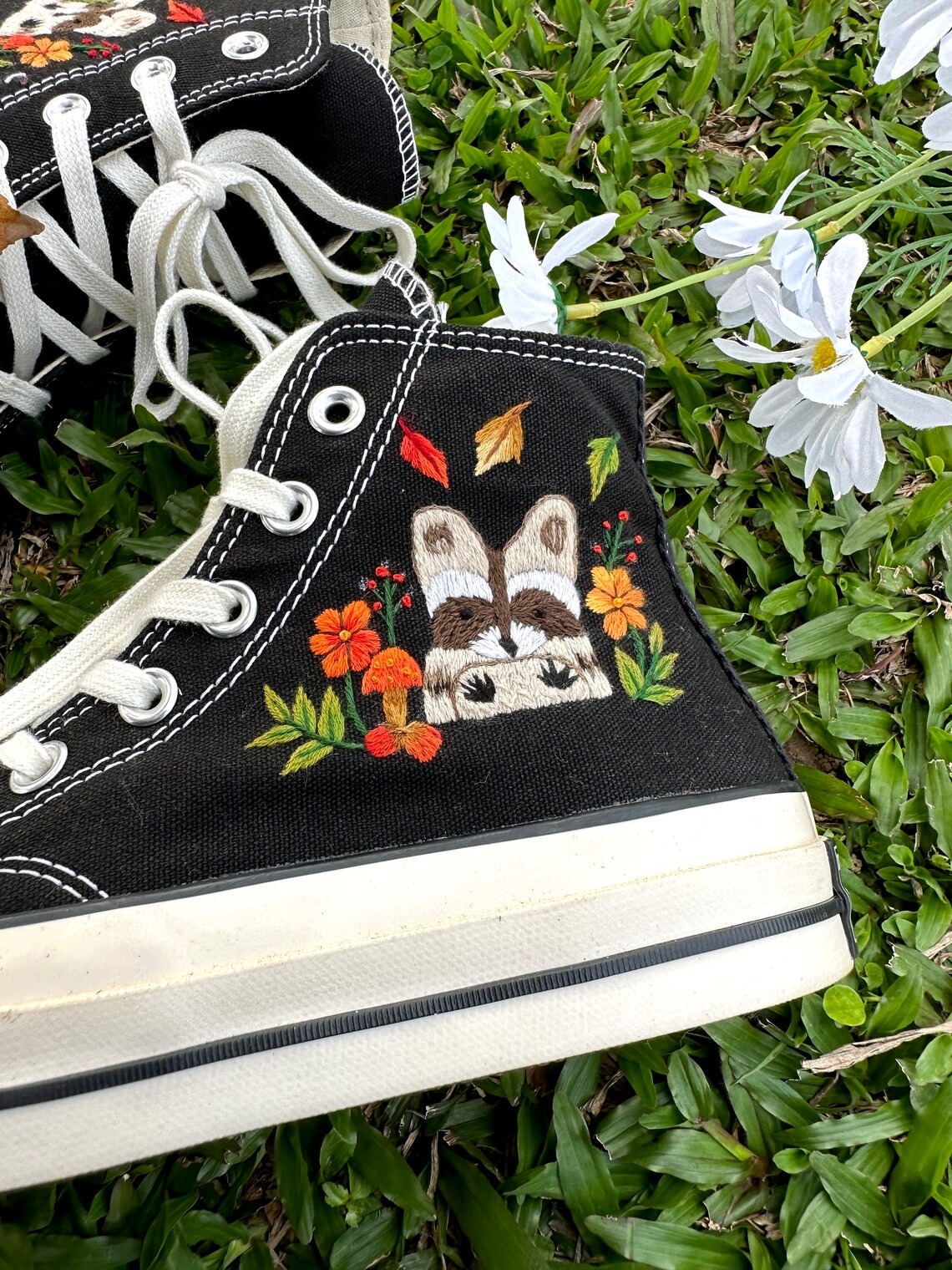 85.3 a3 Converse embroidered raccoons are super cute in the middle of a colorful flower garden.