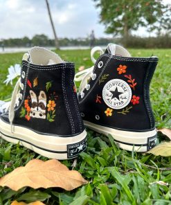 a1 Converse embroidered raccoons are super cute in the middle of a colorful flower garden.