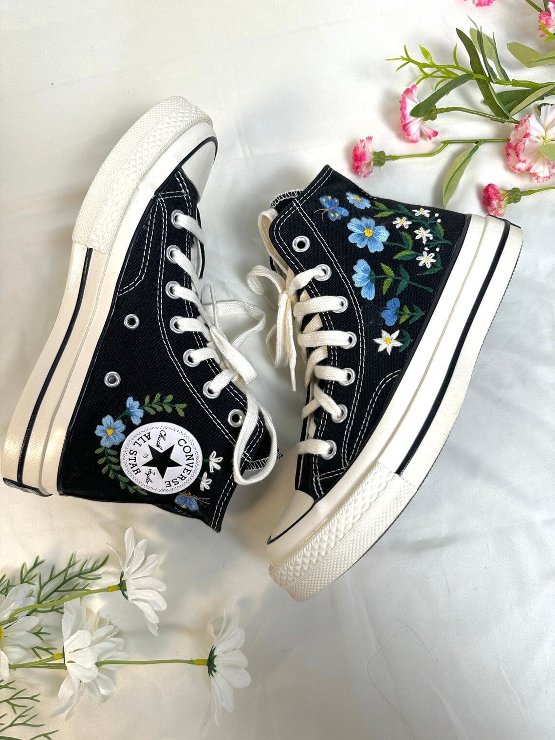86.3 a2. Converse embroidered high tops with blue flowers and monarch butterflies