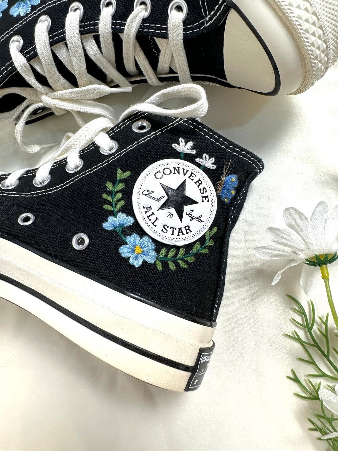 86.4 a3. Converse embroidered high tops with blue flowers and monarch butterflies